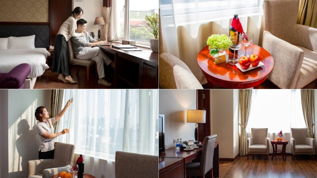 Phòng nghỉ Nesta Hanoi Hotel có cửa sổ hướng phố và bàn làm việc 